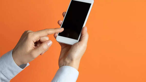 Holding the phone with one hand and scrolling with the index finger of the other