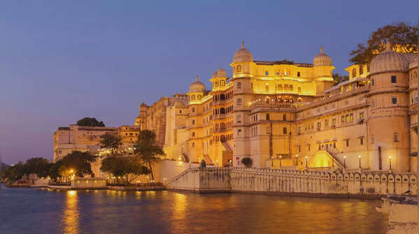 The sun sets over Udaipur's iconic lake palace