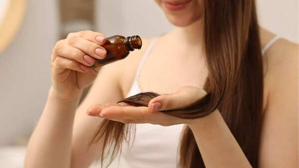 Woman massaging hair oil into scalp