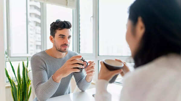 A confident woman making eye contact during a conversation.