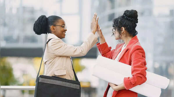Two women celebrating a success.