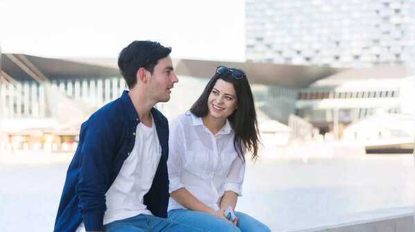 Woman looking at her phone while her partner is away.