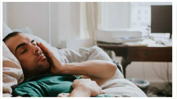 Woman feeling fatigued and weak, a possible colon cancer sign
